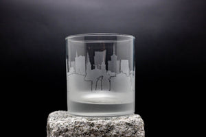 a glass with a picture of a city on it