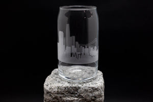 a glass sitting on top of a rock