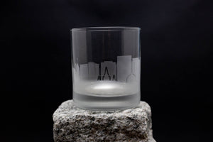 a glass sitting on top of a rock