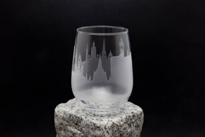 a glass sitting on top of a rock