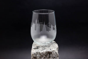 a glass sitting on top of a rock