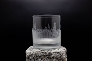 a shot glass sitting on top of a rock