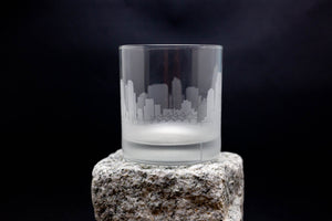 a shot glass sitting on top of a rock