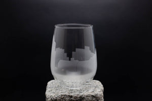 a glass sitting on top of a rock