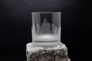 a glass sitting on top of a rock