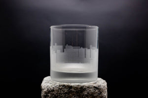 a shot glass sitting on top of a rock