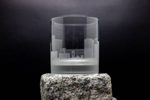 a glass sitting on top of a rock