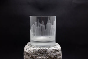 a glass sitting on top of a rock