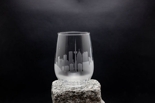 a glass sitting on top of a rock