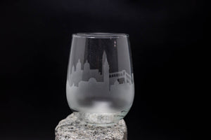 a glass sitting on top of a rock