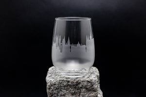 a glass sitting on top of a rock