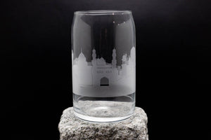 a glass sitting on top of a rock