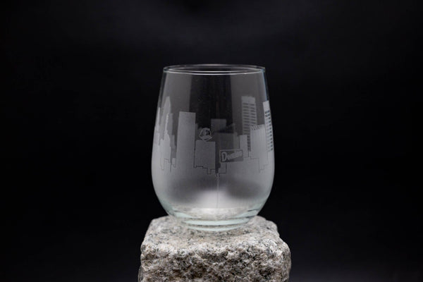 a glass sitting on top of a rock