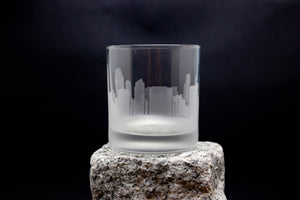 a glass sitting on top of a rock