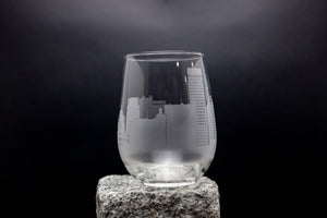 a clear glass sitting on top of a rock