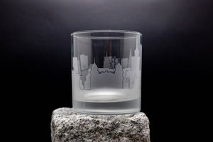 a shot glass sitting on top of a rock