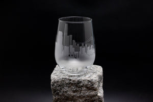 a glass sitting on top of a rock