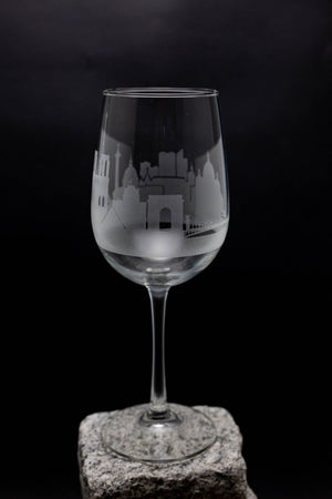 a wine glass sitting on top of a rock