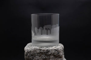 a glass sitting on top of a rock