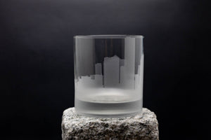 a glass sitting on top of a rock