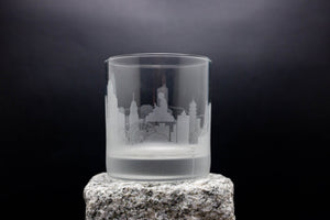 a glass with a picture of a city on it