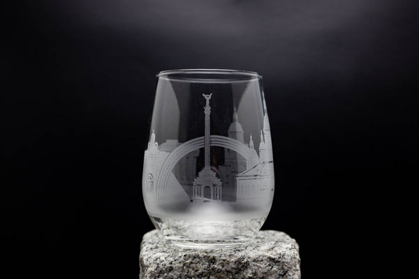 a glass with a picture of a building on it