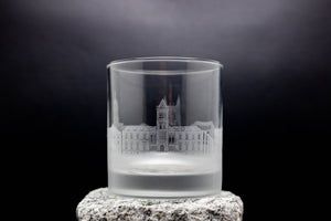 a shot glass with a picture of a castle on it