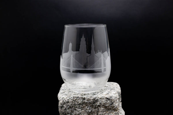 a glass sitting on top of a rock