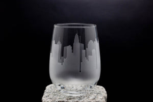 a glass sitting on top of a rock