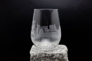 a glass sitting on top of a rock