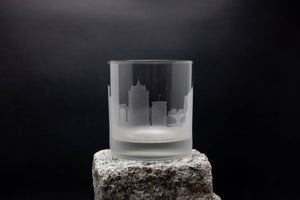 a glass sitting on top of a rock