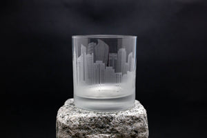 a glass sitting on top of a rock