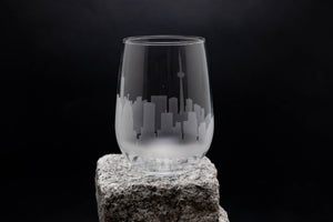 a glass sitting on top of a rock