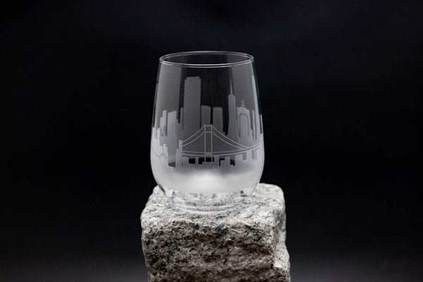 a glass sitting on top of a rock