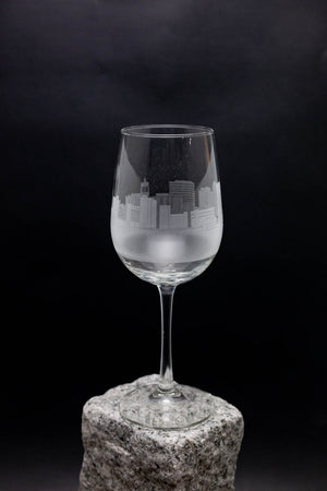 a wine glass sitting on top of a rock