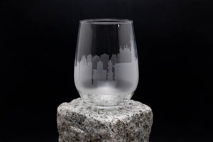 a glass sitting on top of a rock