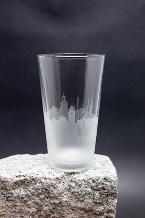 a shot glass sitting on top of a rock