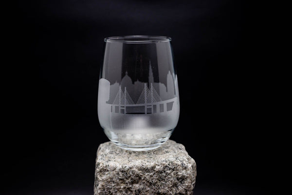 a glass sitting on top of a rock