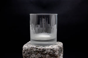 a glass sitting on top of a rock