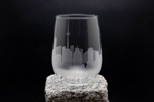 a glass sitting on top of a rock