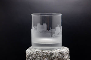 a glass sitting on top of a rock