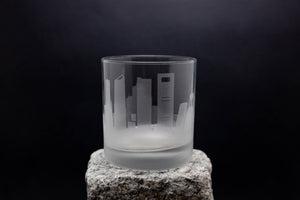 a glass sitting on top of a rock