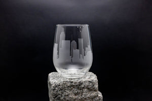 a glass sitting on top of a rock