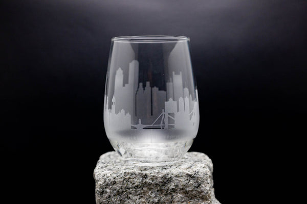 a glass sitting on top of a rock