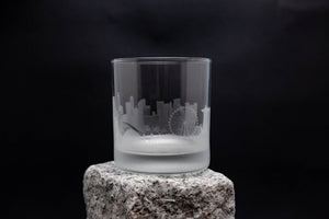 a glass sitting on top of a rock