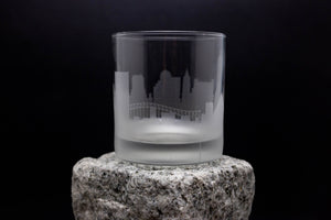 a glass sitting on top of a rock