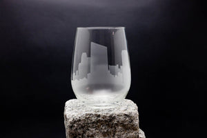 a glass sitting on top of a rock