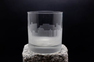 a glass sitting on top of a rock