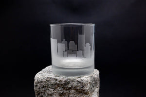 a glass sitting on top of a rock