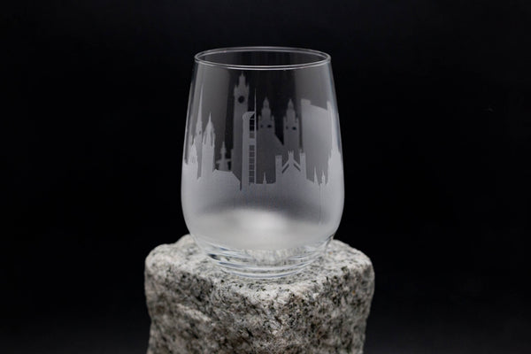 a glass sitting on top of a rock